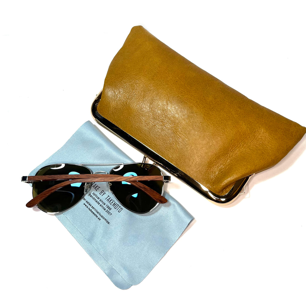 First leather cowhide  kiss lock purse clutch